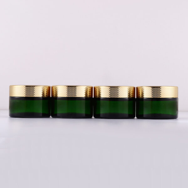 green glass cosmetic jar